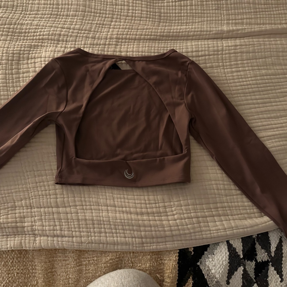 Never worn Lazuli Label gym top.